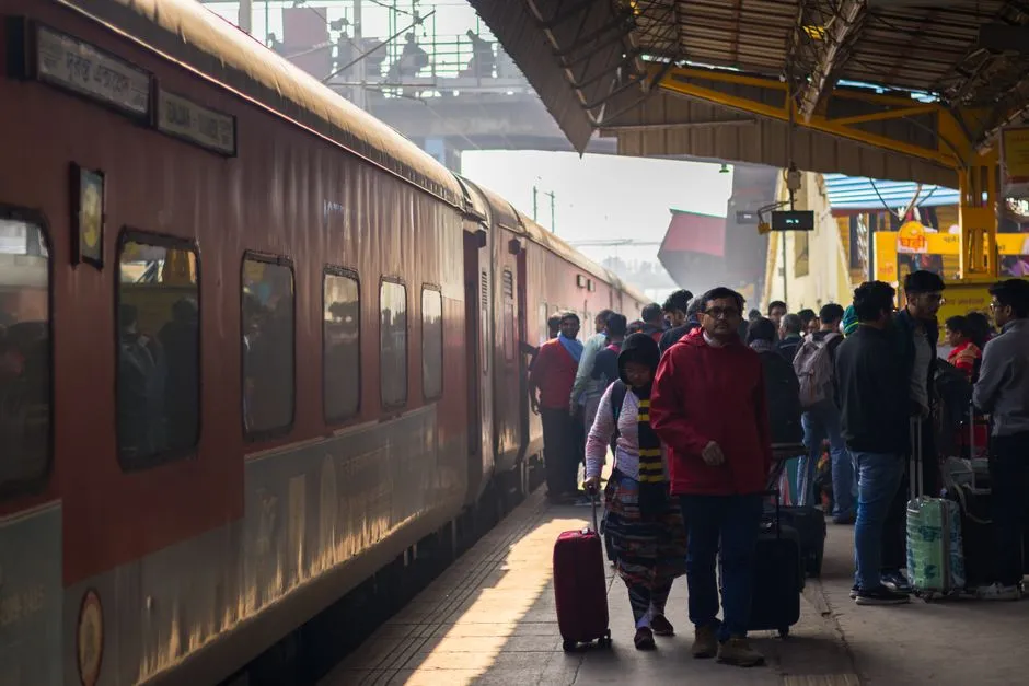 Passengers waiting on a busy train station platform